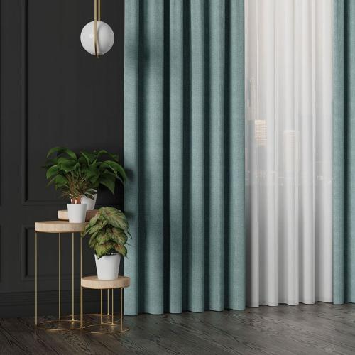 Zasłona IBIZA w turkusowym odcieniu zawieszona w nowoczesnym salonie.
